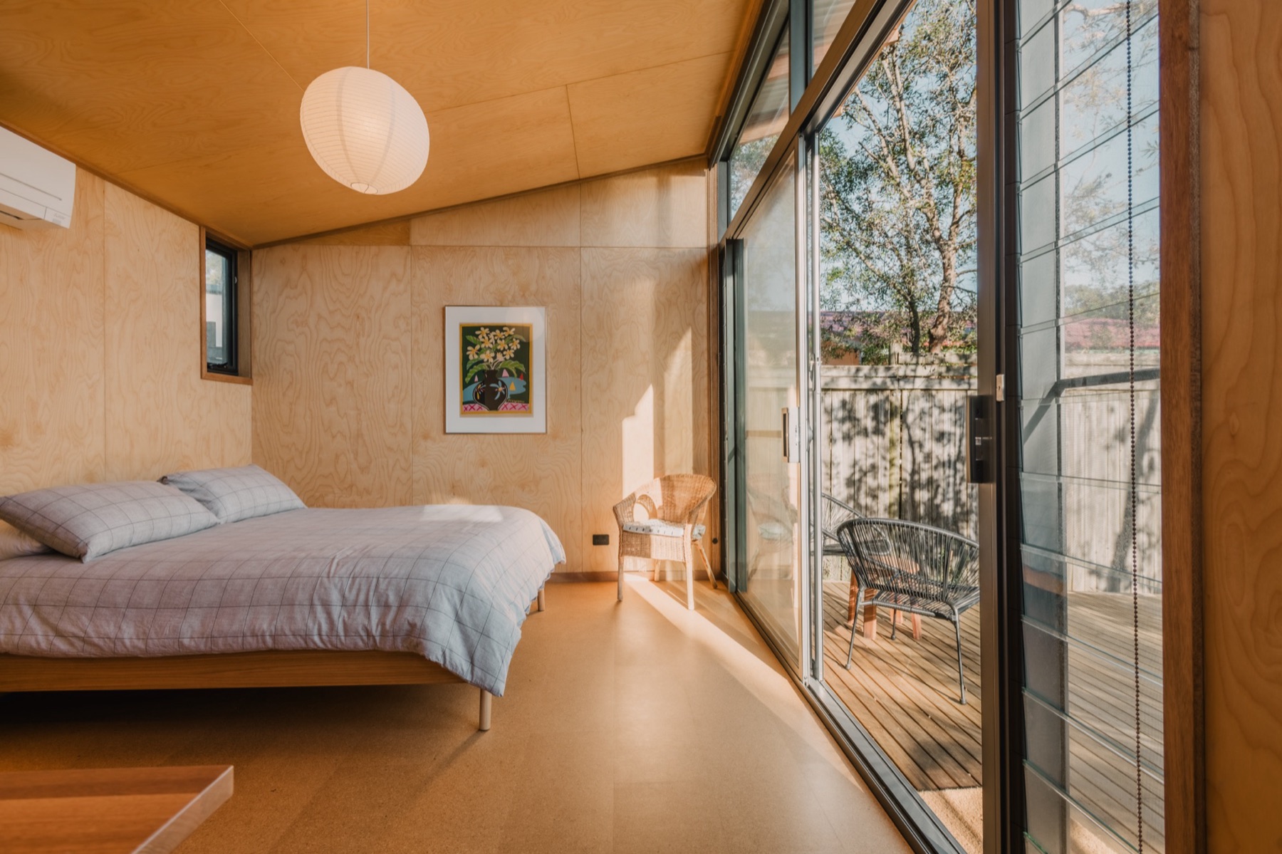 Broulee Workshop studio interior with birch ply walls and sliding glass door